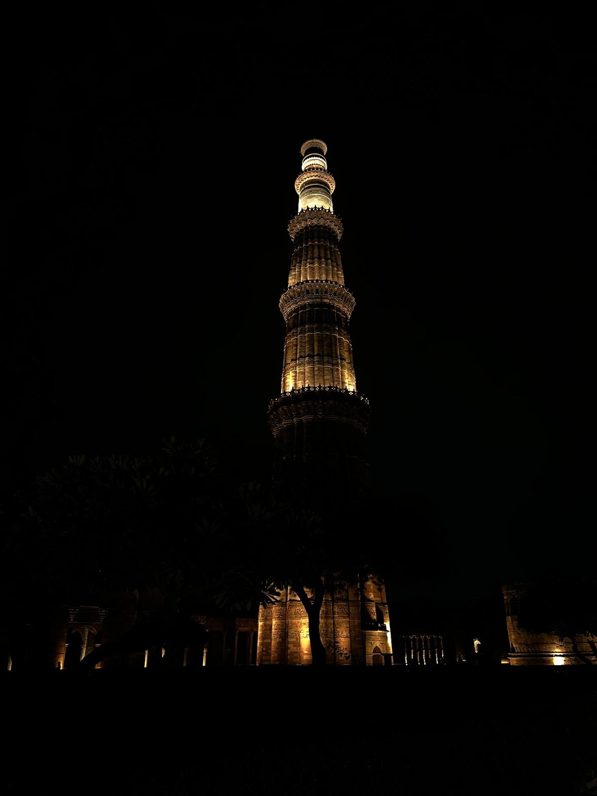 Qutub Minar illuminated at night